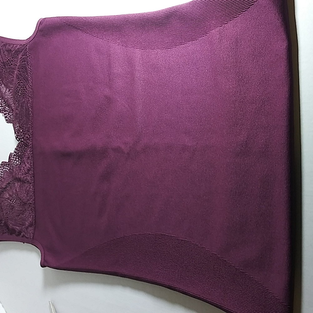 No Brand Name on tag. Purple top with Lacey inserts.